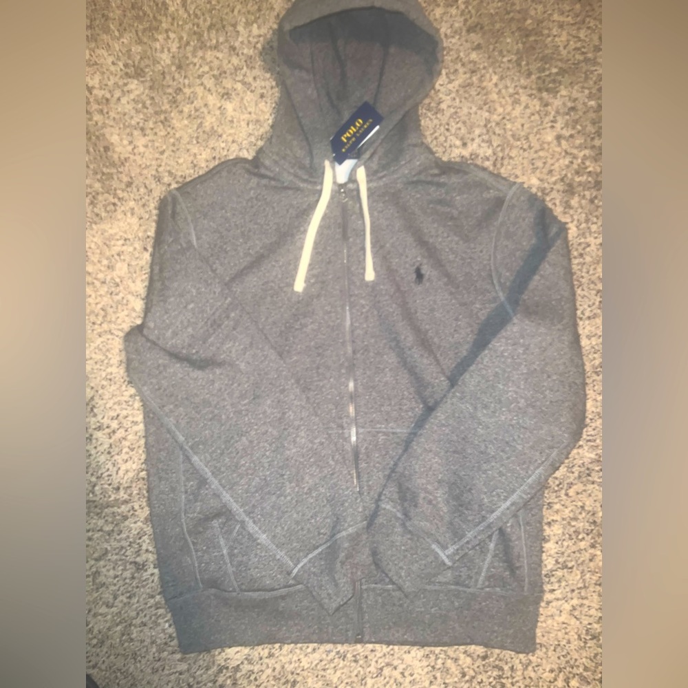 Brand new never worn size large zip up hoodie, tags still on it